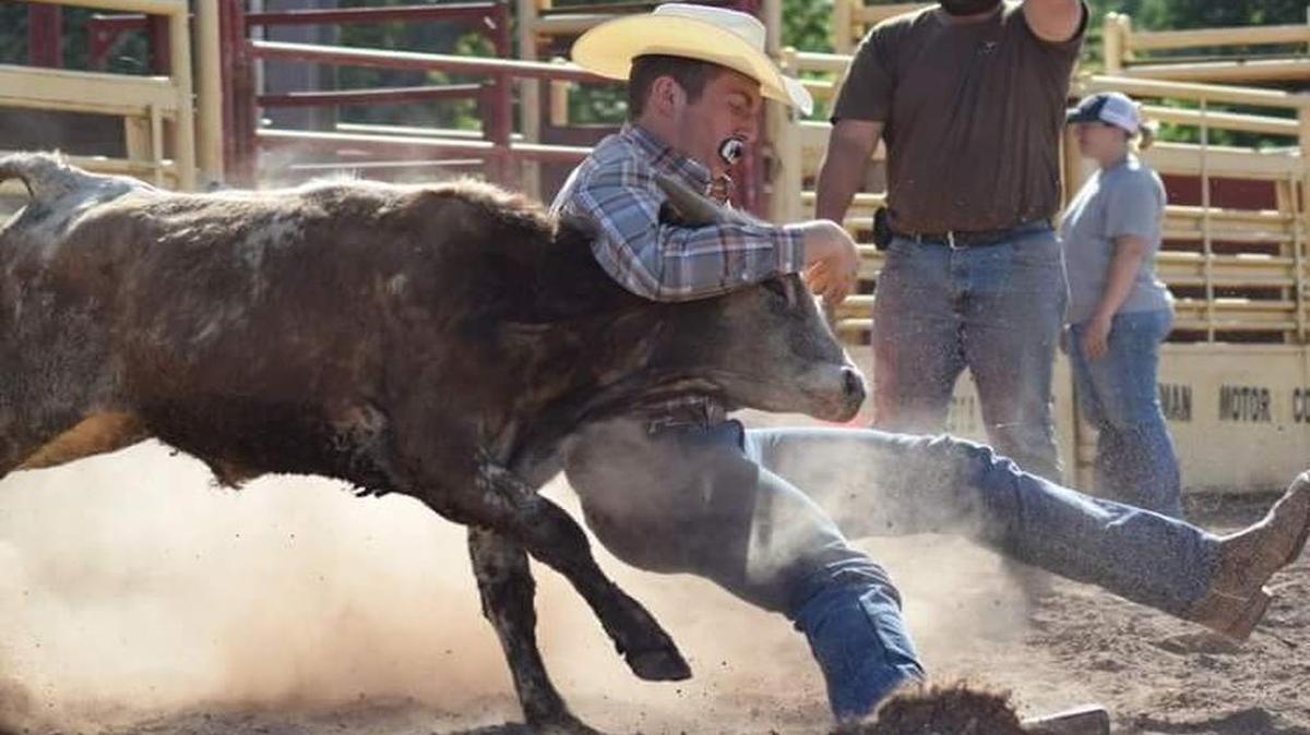 Penns Valley senior Justin Sands wrestles with a steer during a Keystone Junior Roseo Association event in Benton in July.