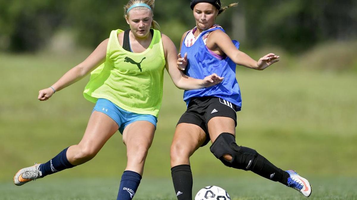 Penns Valley's Olia Corman kicks the ball past a teammates during practice earlier this month. The Lady Rams are looking to make another run in the district playoffs this year.