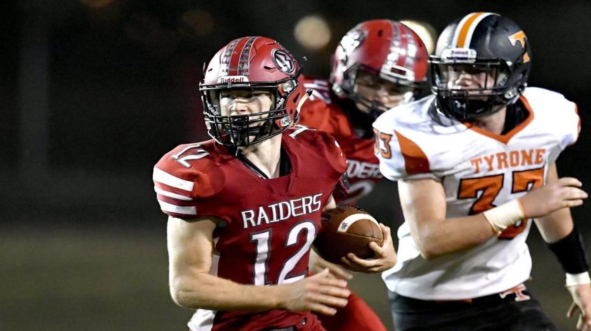 Bellefonte’s Cade Fortney runs down the field with the ball from Tyrone defenders during Friday’s game. The senior wide receiver scored through the air and on the ground.