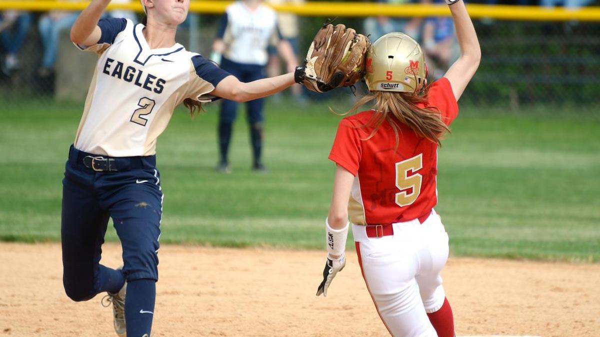 Bald Eagle Area shortstop Mikala Smith (2) tags the helmet of Bishop McCort runner Jenna Gaunt as she runs to second base. Gaunt was called safe. BEA defeated Bishop McCort, Monday, 9-2.