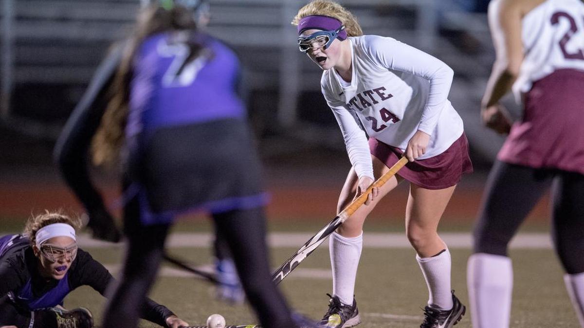 State College's Kelsey Love runs down the field with the ball from Mifflin County defenders during the District 6 championship game on Wednesday, October 26, 2016 at Bald Eagle Area's Alumni Field. State College won, 3-0.