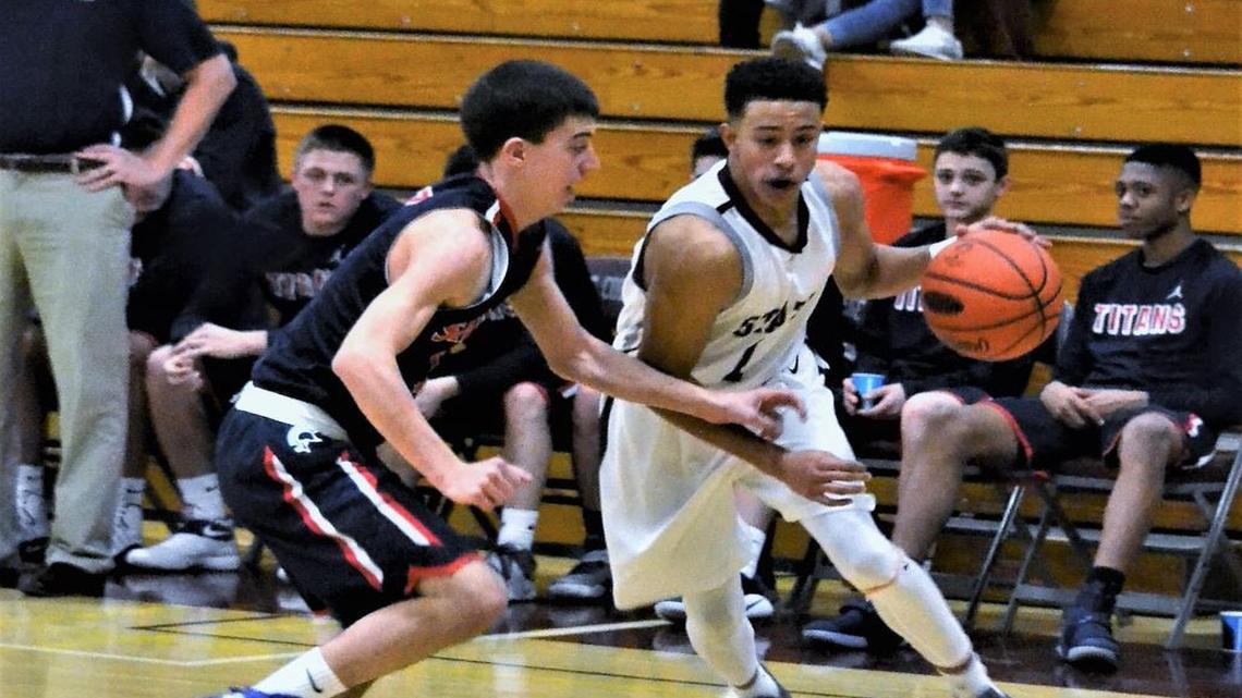 State College’s Keaton Ellis looks to drive around a Shaler defender in the Little Lions’ 80-54 win in the opening round of the Kiwanis Holiday Classic on Wednesday.
