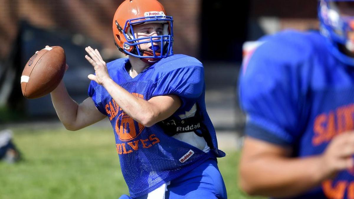 Quarterback Brendan Robinson makes a pass during Saint Joseph's Catholic Academy football practice on Aug. 17.