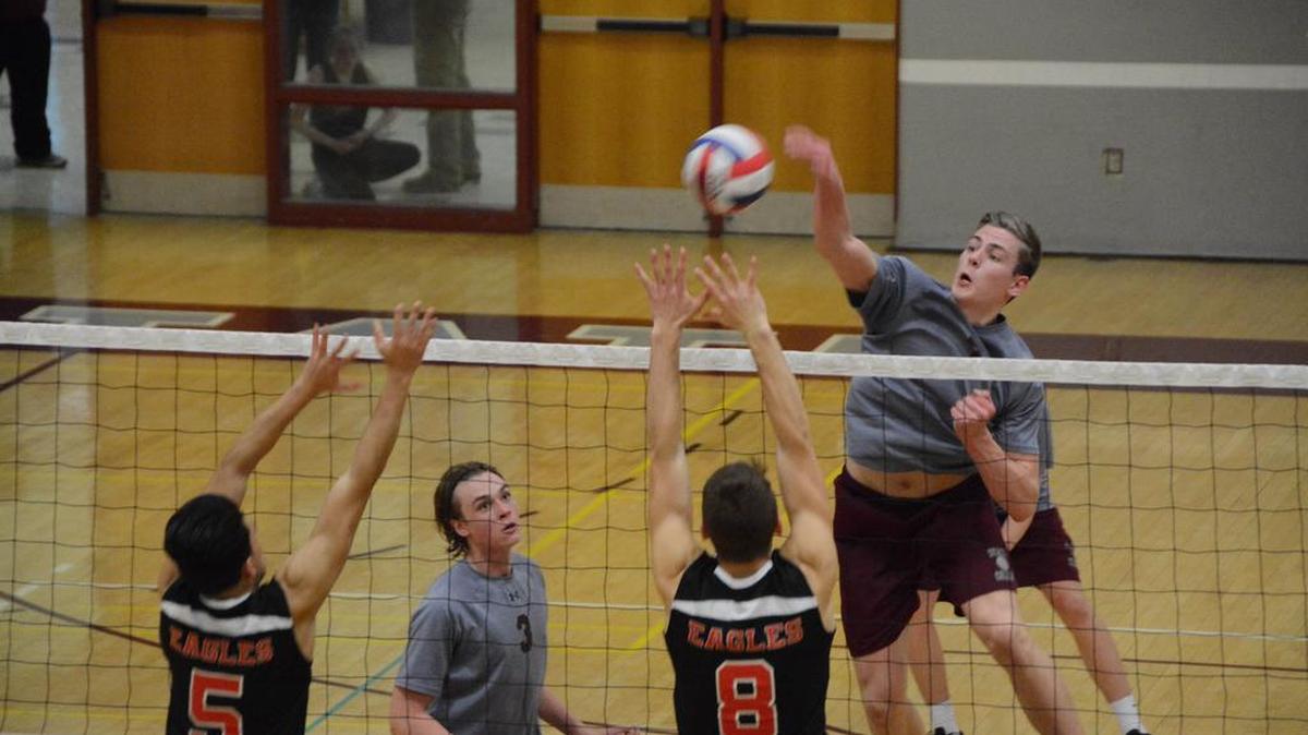 State College’s Gabe Avillion,right, takes a swing from a set from Walker Stone (3) during the Little Lions’ match against Cumberland Valley on Tuesday. State College won 3-0.