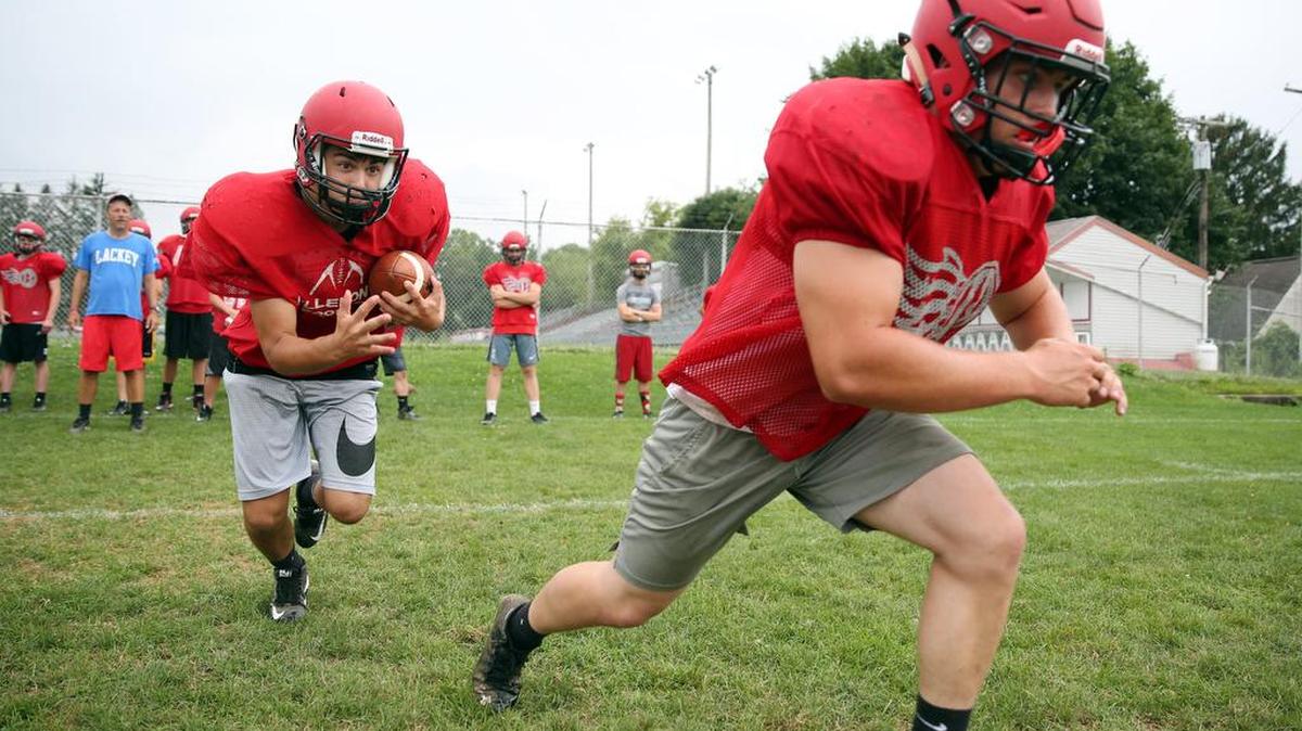 Bellefonte fullback Stephen Kutches, right, practices paving the way for teammate Logan Houser during a drill earlier this month. Kutches moved from fullback to offensive lineman and back to fullback over the past 12 months.