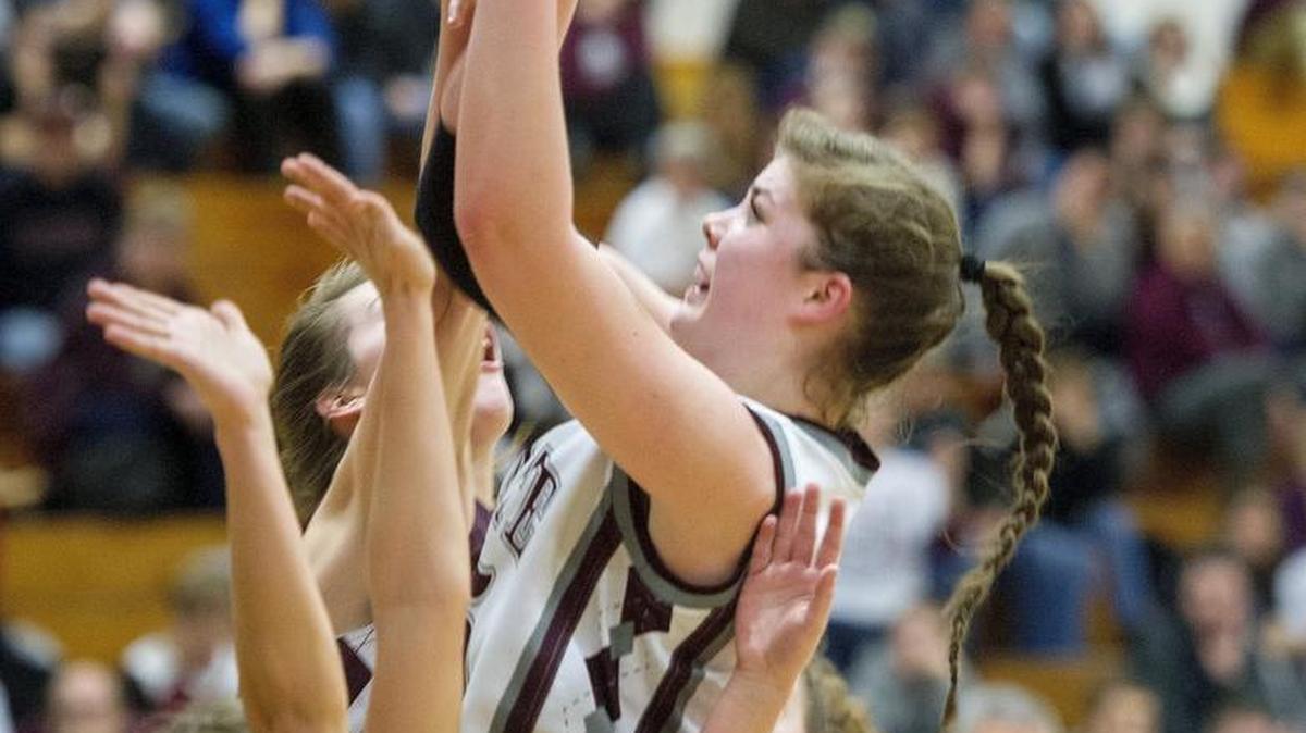 State College’s Kyla Irwin shoots over Altoona defenders during Thursday’s girls’ basketball game. State College won 69-54 and Irwin set the school scoring record.