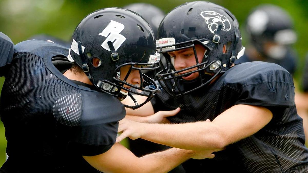 Philisburg-Osceola lineman run blocking drills during Mountie practice on Aug. 18, 2017 at Memorial Field.