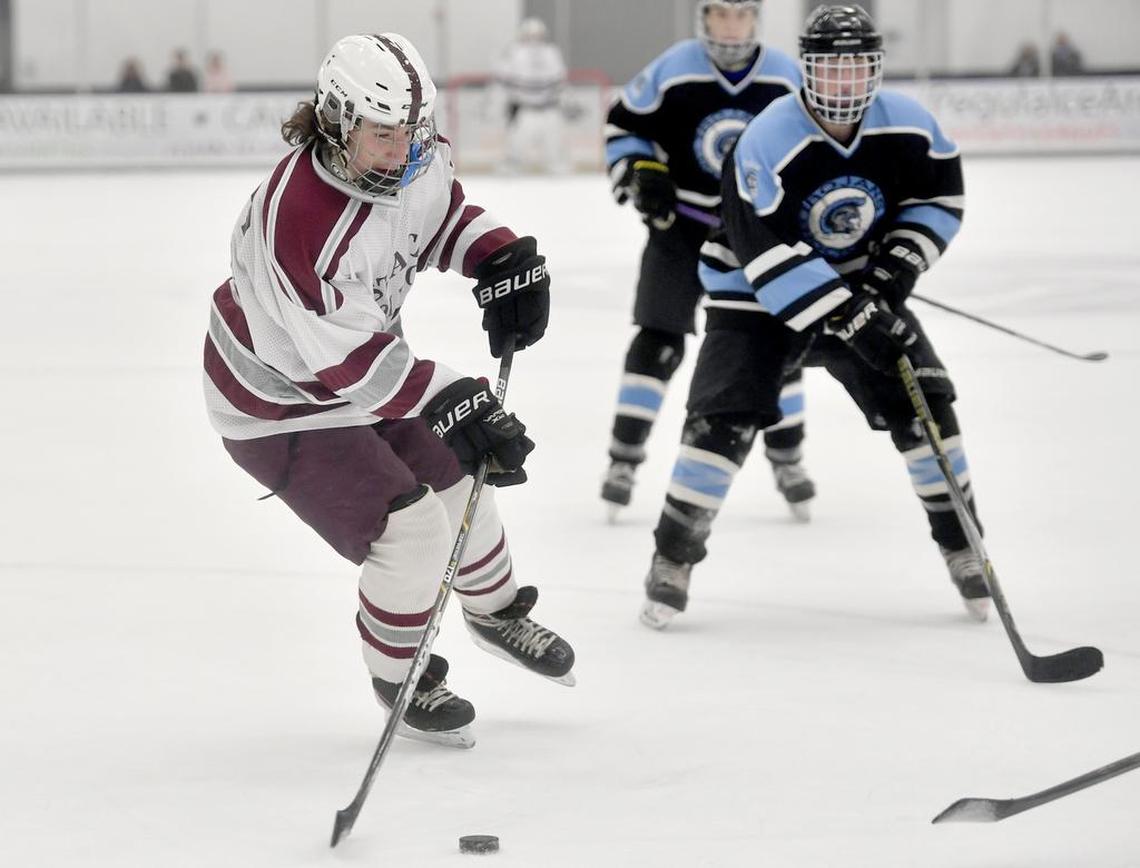 State College’s Kaleb Barth skates down the ice with the puck ahead of a Johnstown defender during the game on Nov. 30, 2017 at Pegula Ice Arena.