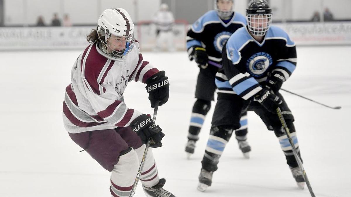State College’s Kaleb Barth skates down the ice with the puck ahead of a Johnstown defender during the game on Thursday, November 30, 2017 at Pegula Ice Arena.