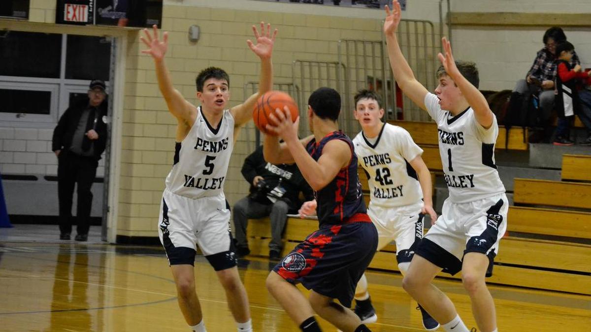 Penns Valley Cole Breon (5), Cameron Shaffer (42), and Logan Snyder (1) defend against the Juniata player.