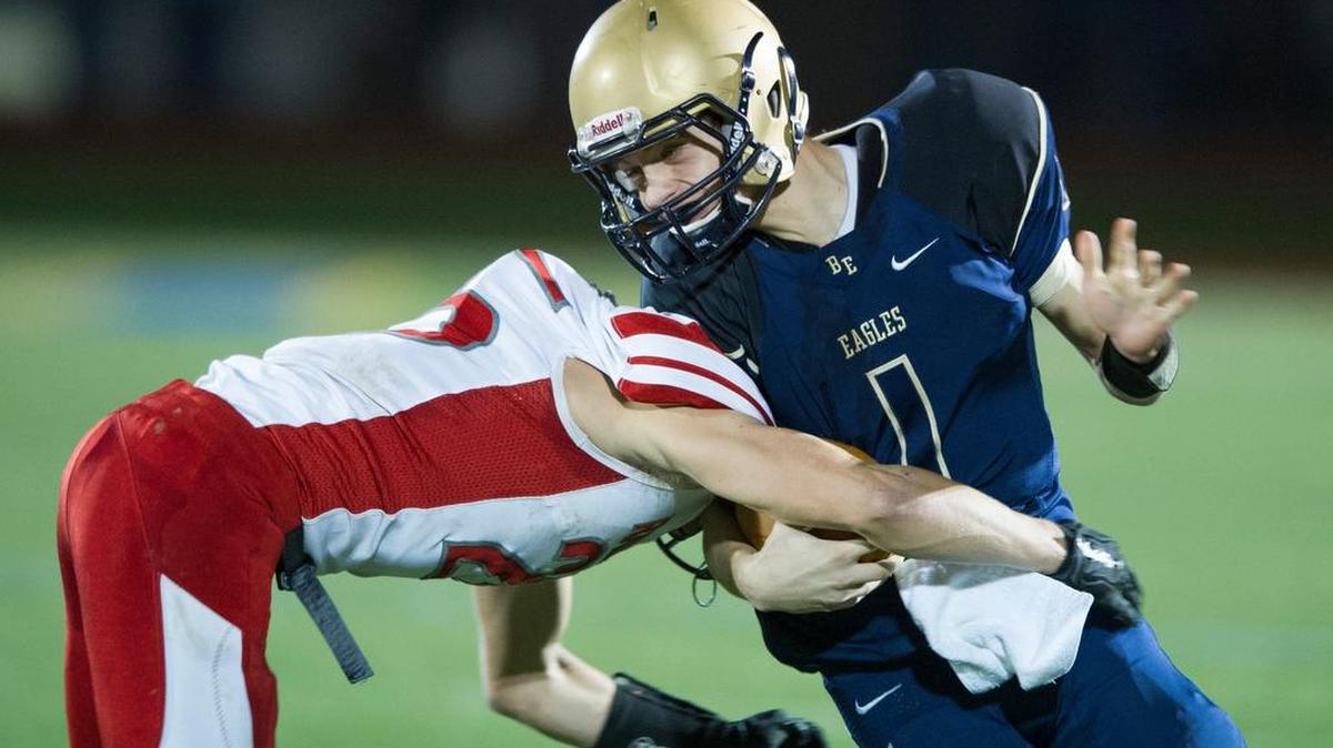 Bellefonte's Tyler Kreger stops Bald Eagle's Tanner Kresovich during a football game on Friday, Nov. 6, 2015.