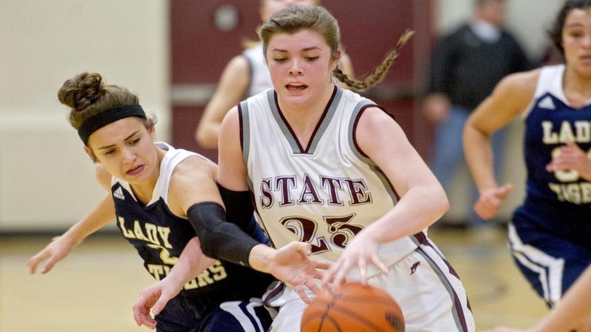 Hollidaysburg’s McKenna Hurd tries to steal the ball from State College’s Kyla Irwin as she dribbles down the court during the Wednesday, February 10, 2016 game. State College won 76-23.