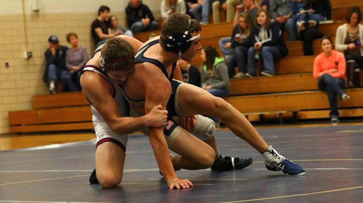Huntingdon’s Logan Fisher brings down Bald Eagle Area’s Dylan Bisel on Tuesday at Bald Eagle Area High School.