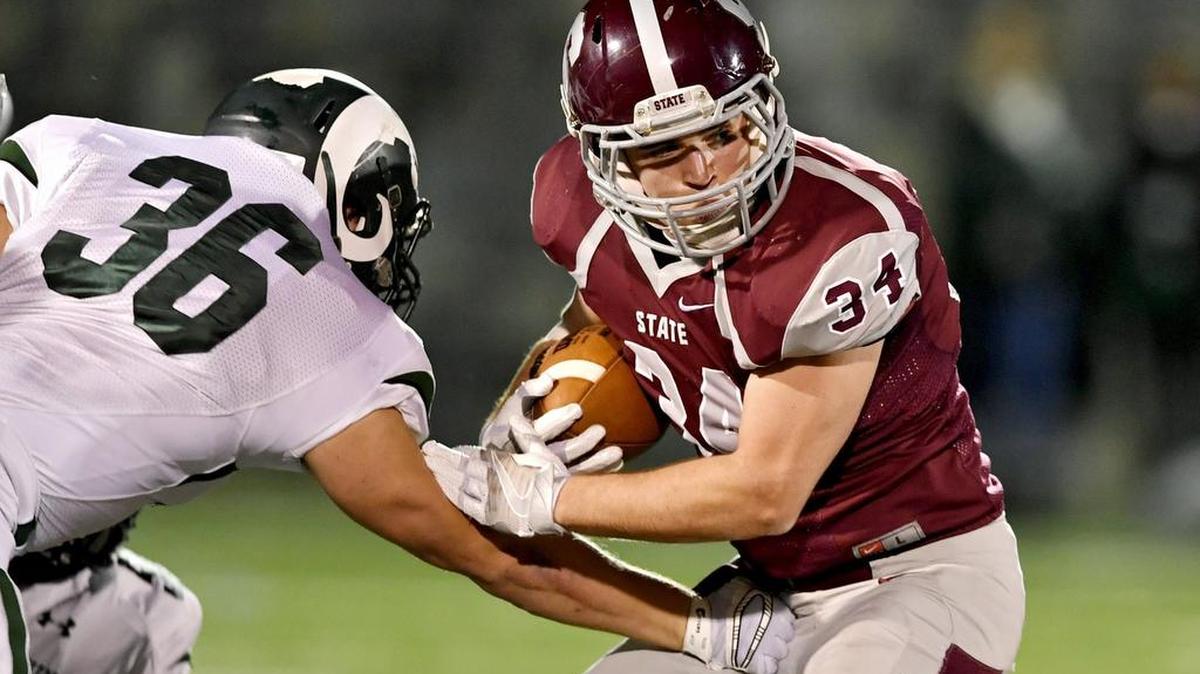 Central Dauphin’s Cole Veliky tries to stop State College’s Pete Haffner as he runs down the field with the ball during the Friday, November 4, 2016 game at Memorial Field. Central Dauphin won, 13-10.