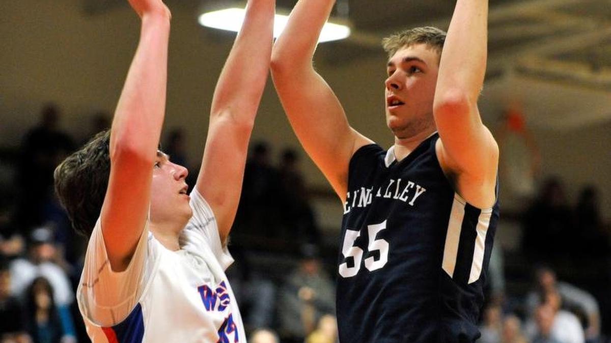 Penns Valley’s Zach Engle shoots over a West Branch player. The Penns Valley Area High School boys’ basketball team played West Branch in the District 6 playoffs Feb. 23, 2016.