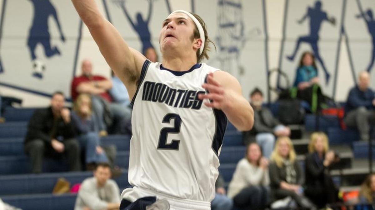 Philipsburg-Osceola’s Caleb Belinda goes in for a basket over Bald Eagle Area’s Trey Butterworth during Wednesday’s game. It was P-O’s first home win in three years. For more on the game, see 3B.