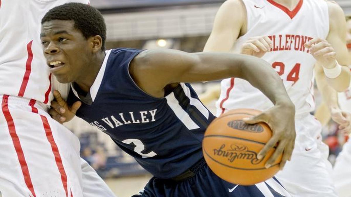 Penns Valley’s Ben Alexander pushes around Bellefonte defenders during a game in December at Rec Hall.