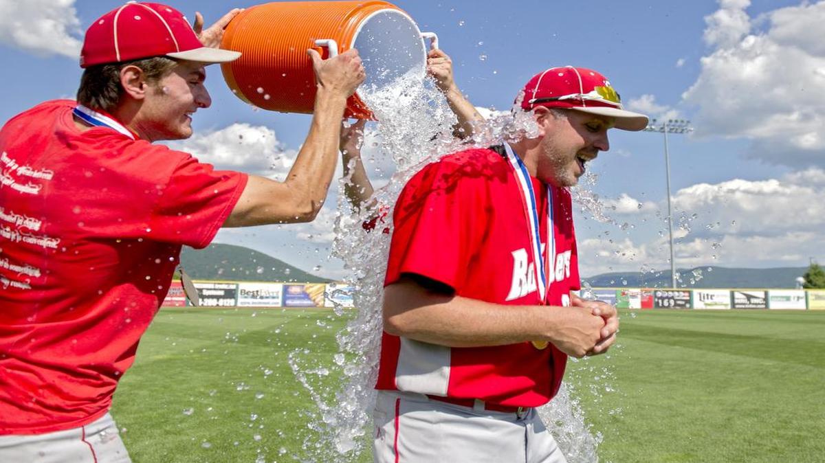Dan Fravel, right, celebrates last season after the Bellefonte baseball team won the PIAA Class 3A state championship. Fravel recently announced his resignation as the Red Raiders coach, citing health issues stemming from a motorcycle accident last August.