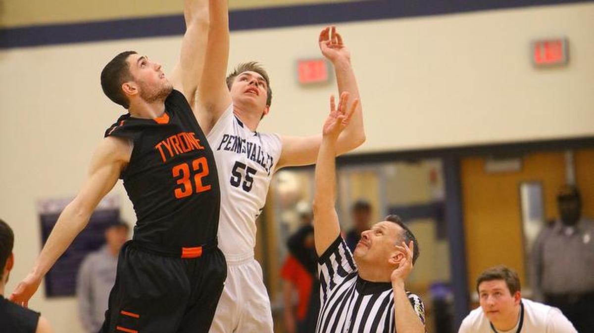 Penns Valley's Zach Engle tips off the ball as the Penns Valley Boys Basketball Team took on Tyrone at Bald Eagle Area High School during the PIAA district playoffs on Thursday.