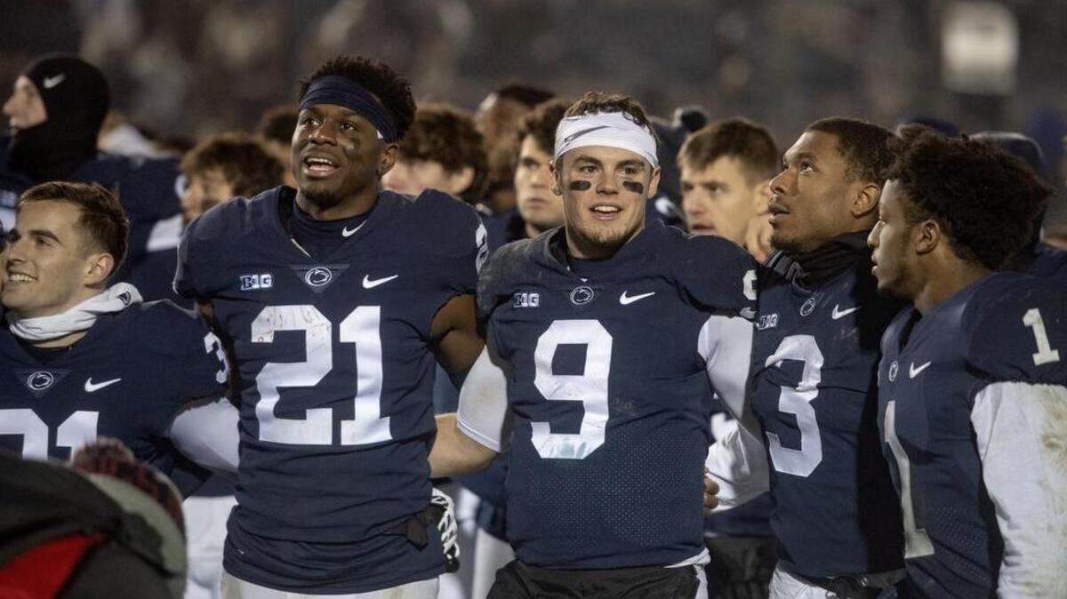 Penn State seniors Amani Oruwariye, Trace McSorley and DeAndre Thompkins link arms to sing the alma mater after the win over Maryland on Saturday, Nov. 24, 2018.