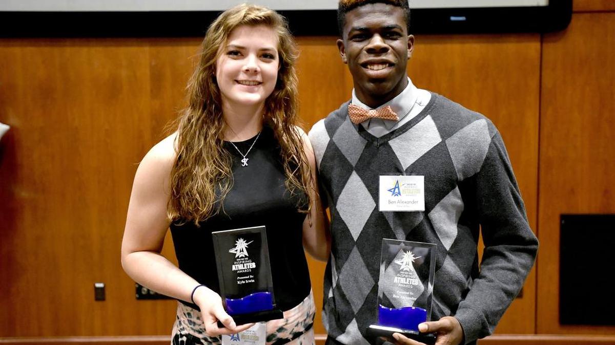 Centre Daily Times Inspiring Athletes award winners Kyla Irwin and Ben Alexander pose together Sunday after the ceremony at Galen & Nancy Dreibelbis Auditorium at Mount Nittany Medical Center.