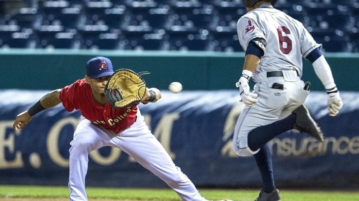 State College Spikes first baseman Ryan McCarvel leans to catch the ball as Mahoning Valley Shredders outfielder Todd Isaacs safely tags first base during the game at Medlar Field on Friday, July 1, 2016.