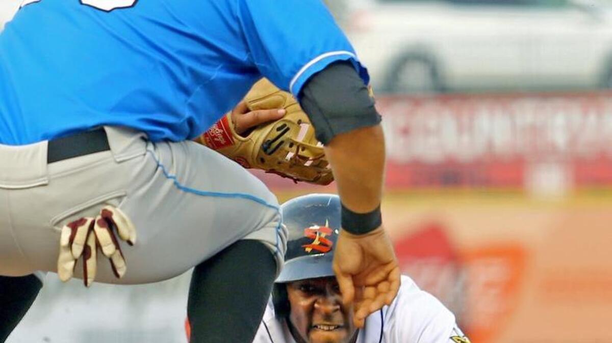 State College Spikes left fielder Vince Jackson dives back to first base after being caught trying to steal second base during the second game of the series against the Hudson Valley Renegades at Medlar Field on Monday, June 20, 2016.