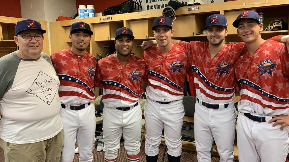 Dave Bohner, grandfather of the State College Spikes’ late honorary base coach Josiah Viera, poses with players at the New York-Penn League All-Star Game Wednesday in at Richmond County Bank Ballpark in Staten Island, New York. Viera was posthumously inducted into the league’s Hall of Fame in a ceremony prior to the game.