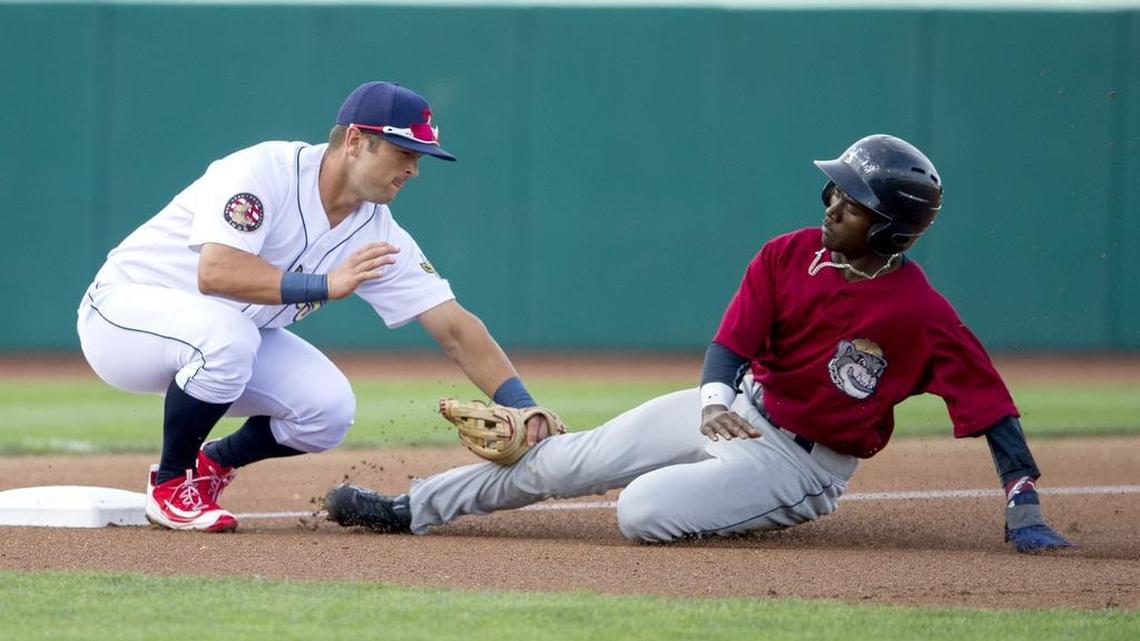 The State College Spikes’ Danny Hudzina tags out Mahoning Valley’s Gabriel Mejia as he tries to steal third base during Saturday’s game.