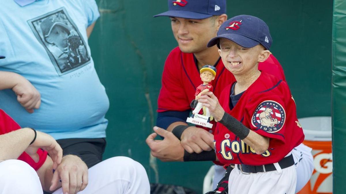 Josiah Viera holds up the bobble head that was made to honor him and was the giveaway for the Saturday, July 9, 2016 game.