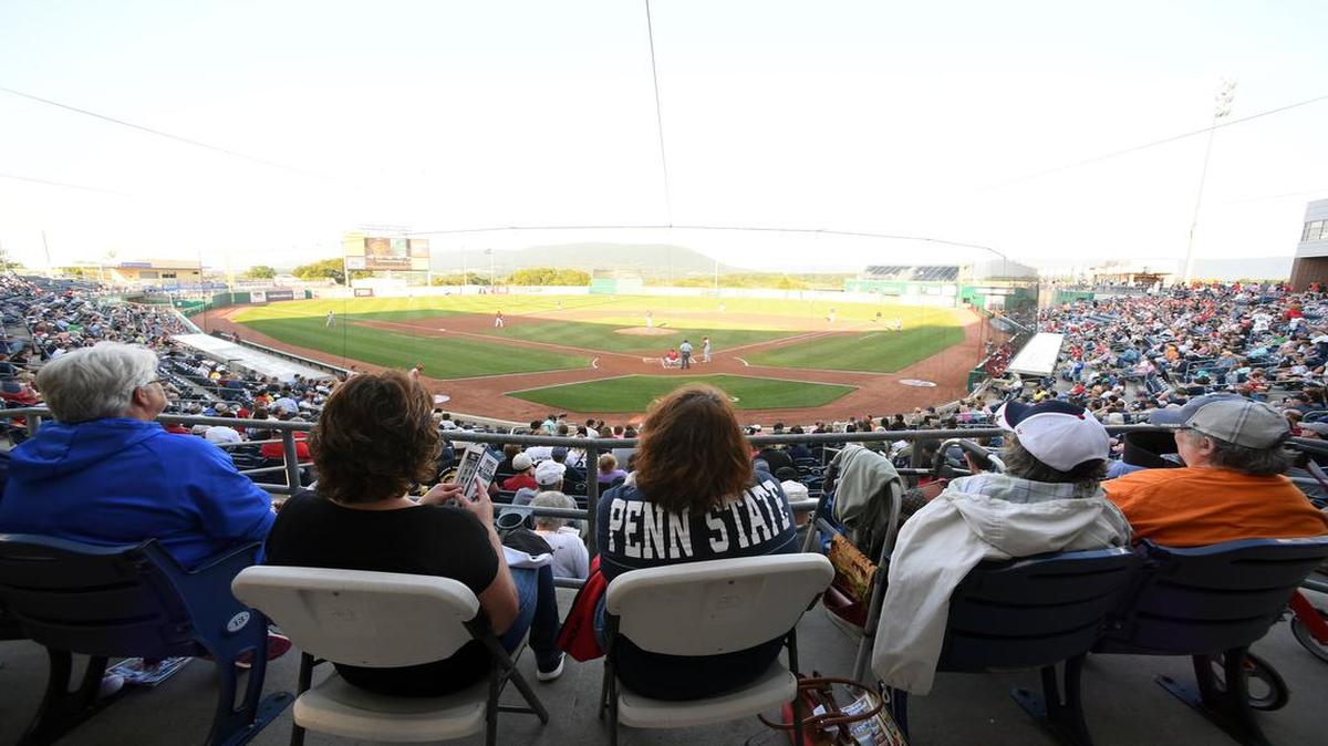 People gather to watch the Spikes baseball team’s opening night Monday at Medlar Field.