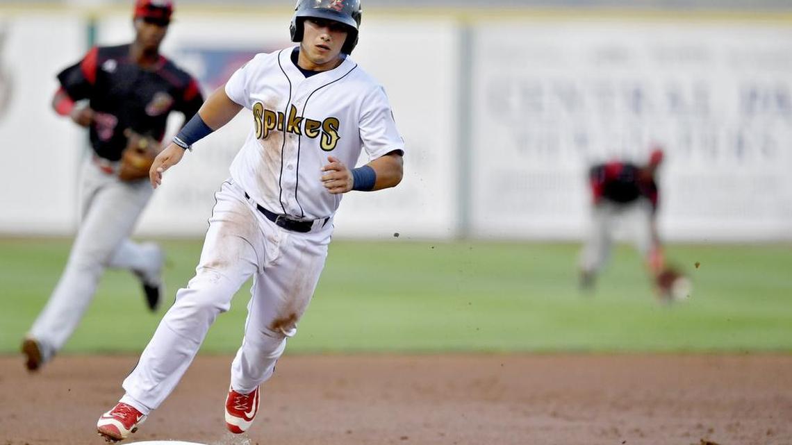 State College Spikes’ Jeremy Martinez rounds third to score as Batavia’s Isaiah White fields the ball in left field. The Spikes won 6-1 on Tuesday at Medlar Field at Lubrano Park.