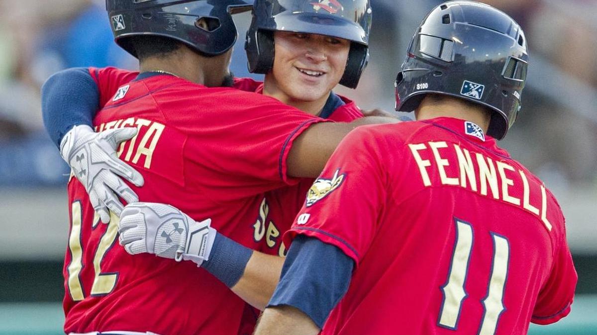 State College Spikes right fielder Ricardo Bautista and center fielder Mick Fennell congratulate second baseman Andy Young at home plate after hitting a home run in the bottom of the second inning in the game against the Auburn Doubledays at Medlar Field on Friday, July 22, 2016.