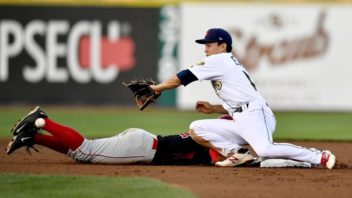 Batavia's Michael Garzillo safely dives back to second as State College's Tommy Edman reaches for the ball during the Thursday, August 25, 2016 game.