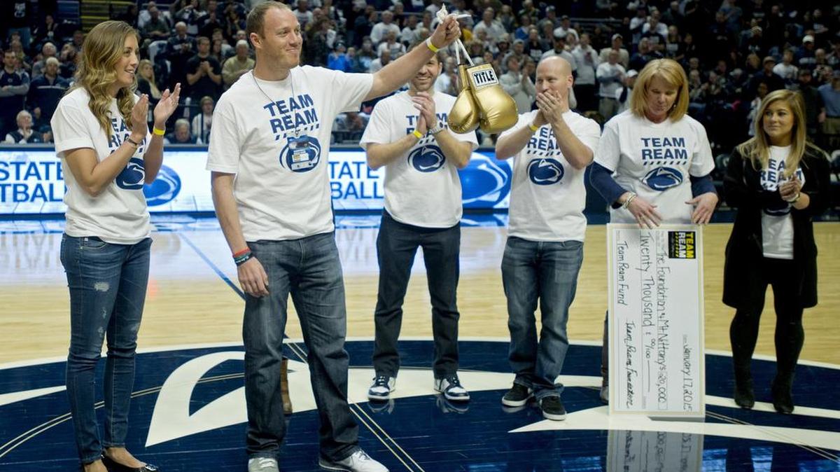 The Tennessee Titans signed former player Tim Shaw, second from left, who’s battling ALS, to a one-day contract Wednesday.