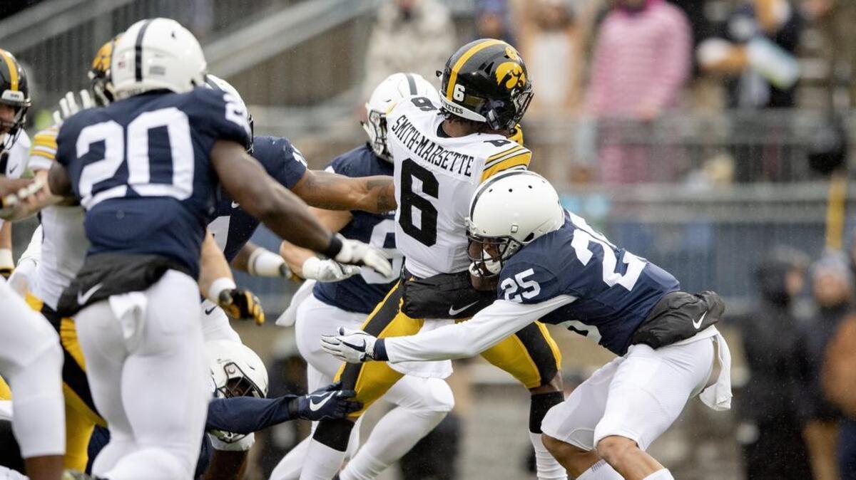 Penn State linebacker Brelin Faison-Walden reaches to take down Iowa wide receiver Ihmir Smith-Marsette during the game on Saturday, Oct. 27, 2018.