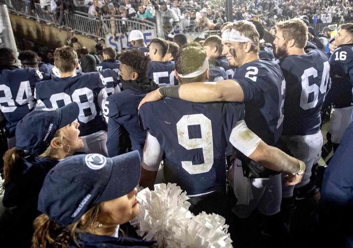 Penn State quarterbacks Trace McSorley and Tommy Stevens walk off the field together celebrating the win over Iowa on Saturday, Oct. 27, 2018.