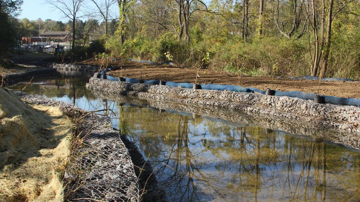 Two tiers of gabion baskets line the storm water channel that leads into Duck Pond along College Avenue in State College. The area has seen major improvements to curtail erosion.
