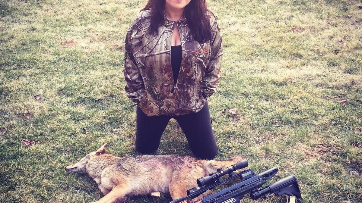 Renee Varner poses with a coyote that she legally harvested on March 10.