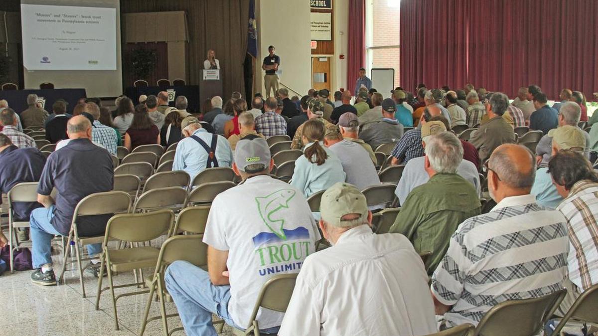 A crowd of fishing enthusiasts listen to a presentation by Merrdith Bartron from the U.S. Fish and Wildlife Service. Over 240 people attended the Wild Trout Summit in Pleasant Gap on Aug. 26.