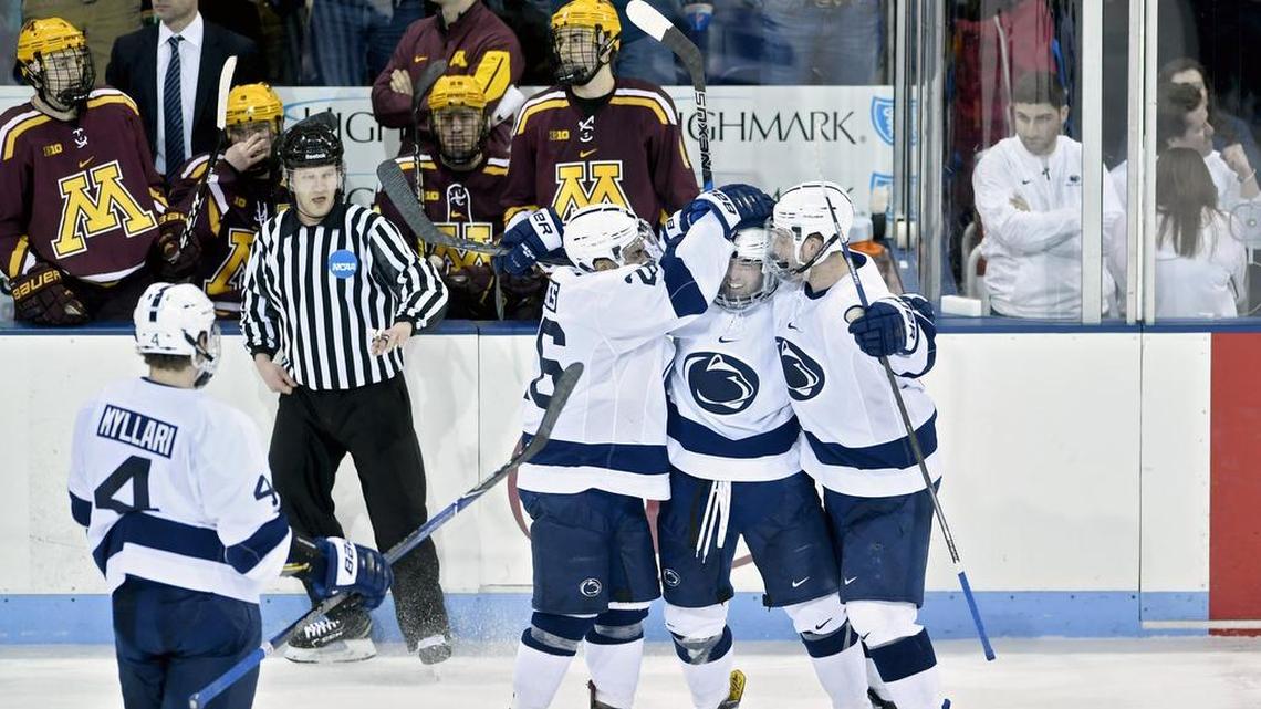 Penn State’s Evan Barrett is congratulated by his teammates for his goal in the third period to put the Nittany Lions in the lead, 6-5, during the game against Minnesota on Saturday, March 3, 2018 at Pegula Ice Arena. Penn State won, 6-5, to move on to the semifinals in the Big Ten tournament.