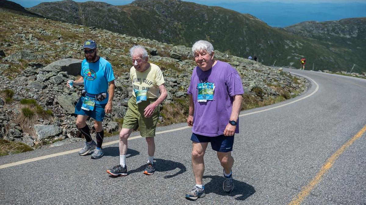 Retired Penn State professor and State College resident George Etzweiler, center, climbs Mount Washington in New Hampshire on June 18 with his son, Larry, right, and grandson Robert. It is the 11th time George Etzweiler, 96, has summited the mountain in the annual race up the 7.6-mile road.