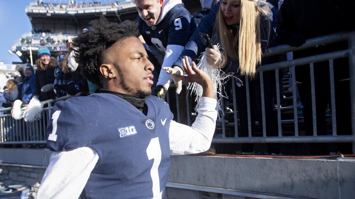 Penn State wide receiver KJ Hamler high-fives fans in the student section after the win over Wisconsin on Saturday, Nov. 10, 2018.