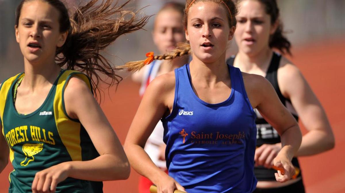 Saint Joseph's Catholic Academy's Jordan Wiser runs the first leg of the girls 4x800 relay. The PIAA District VI Track and Field meet was held in Altoona, Pa., at Mansion Park May 12, 2015.
