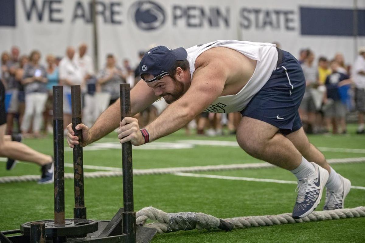 Penn State offensive lineman Ryan Bates competes in the sled push during the annual Lift For Life at Holuba Hall on Saturday, June 30, 2018.