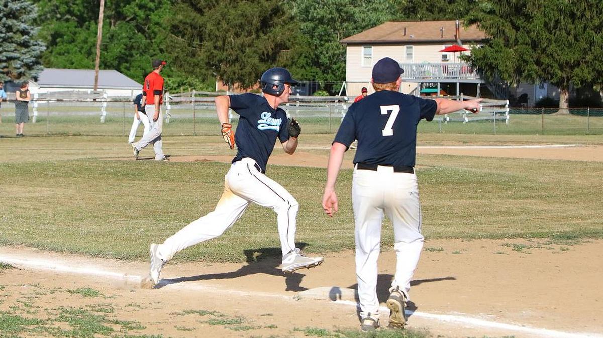 Lemont's Mark Milutinovic rounds first base against Howard in Howard on Thursday night during a Centre County League baseball game.